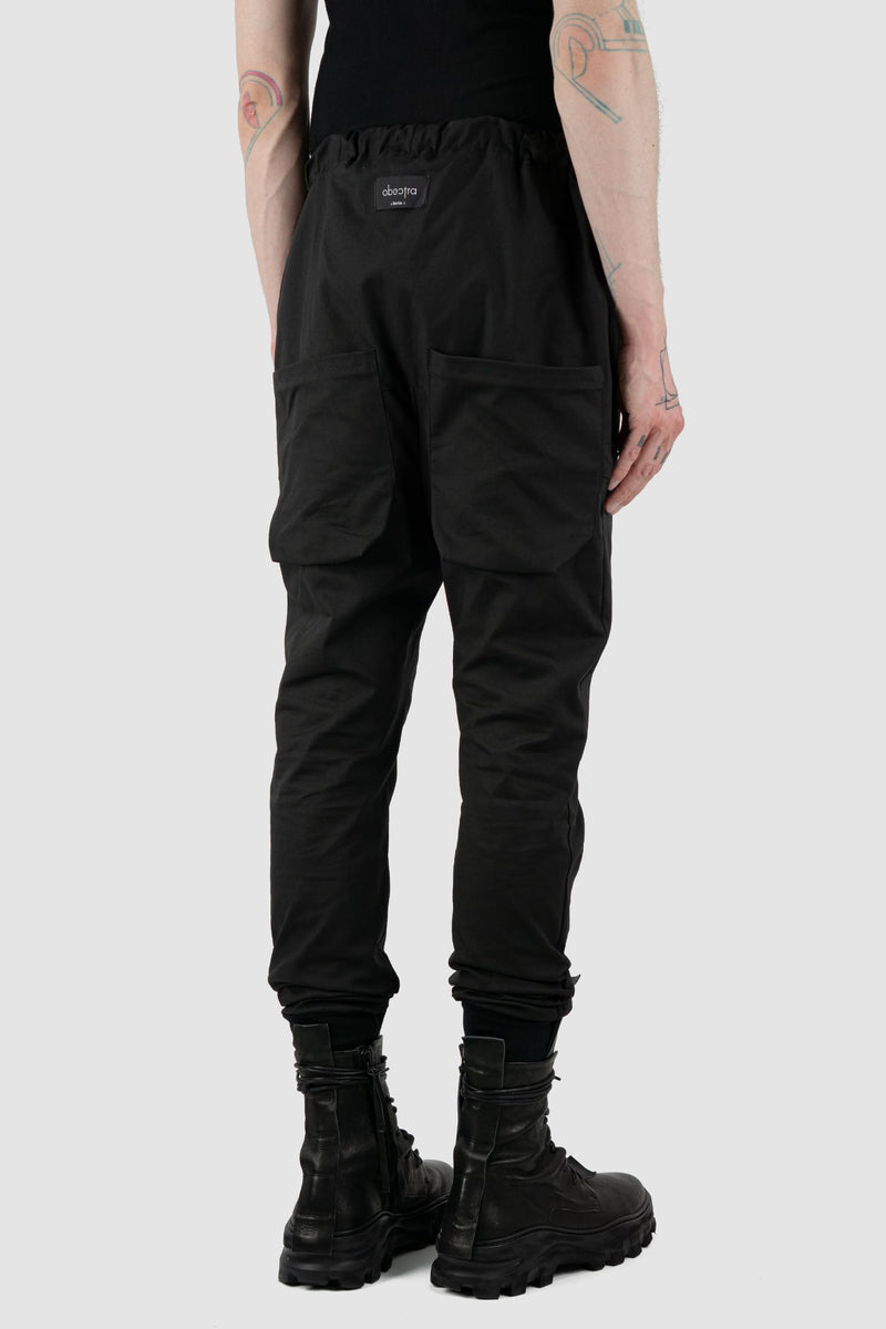 Obectra Studio - Back side view of Black Cotton Dawn jogger pants with lower positioned back pockets, regular fit, Permanent Collection.