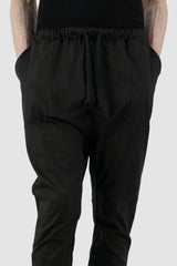 Obectra Studio - Waist detail view of Black Cotton Dawn jogger pants with lower positioned back pockets, regular fit, Permanent Collection.