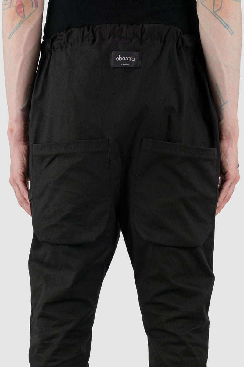 Obectra Studio - Back detail view of Black Cotton Dawn jogger pants with lower positioned back pockets, regular fit, Permanent Collection.