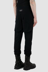 Obectra Studio - Back side view of Black Cotton Luna Sweatpants with lower positioned back pockets, regular fit, Permanent Collection.