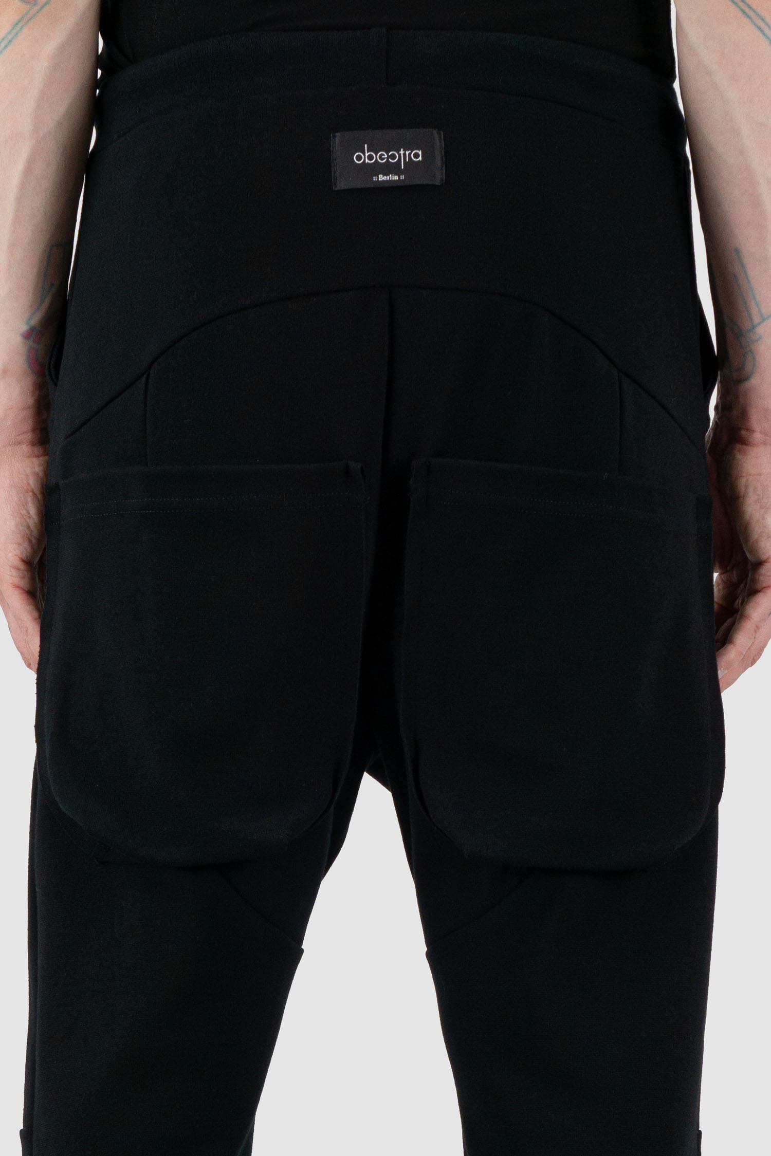 Obectra Studio - Back detail view of Black Cotton Luna Sweatpants with lower positioned back pockets, regular fit, Permanent Collection.