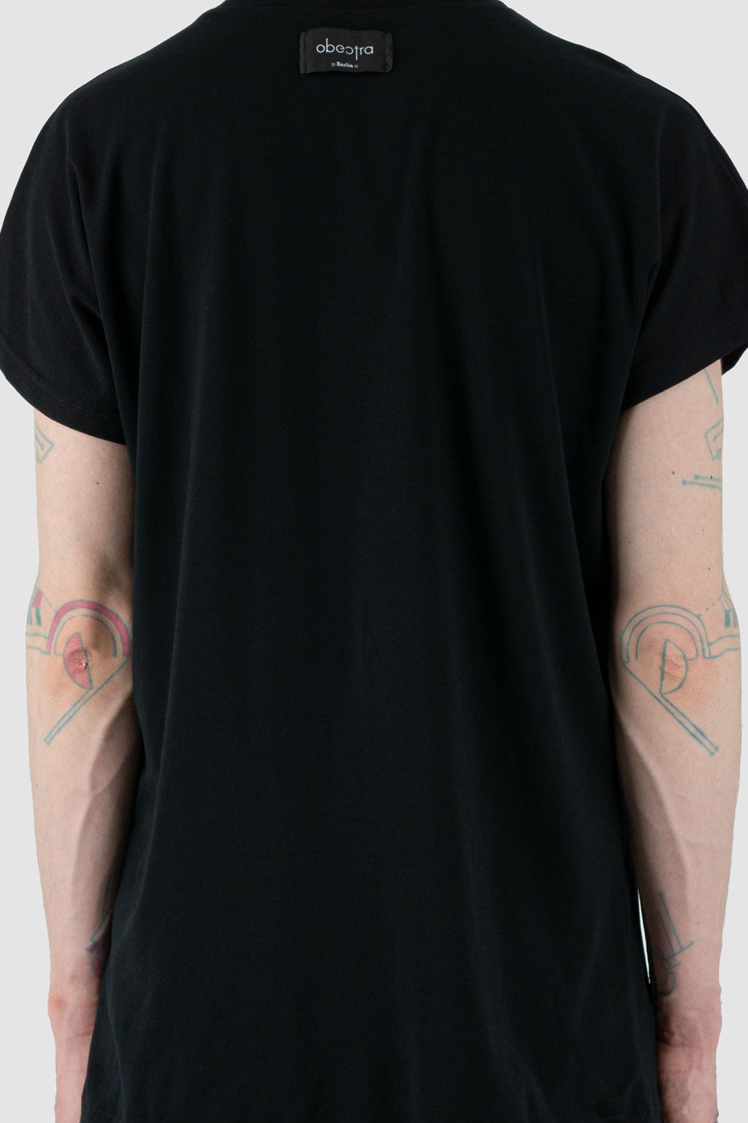 Obectra Studio - back detail view of Black Cotton Mint T-shirt with raglan shoulders, round neck detail, regular fit, Permanent Collection.