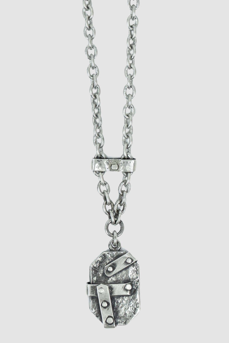 OLIVIER 925 silver Anken Pendant from the Permanent Collection, featuring a silver plate embellished with studs and patches, detail view.