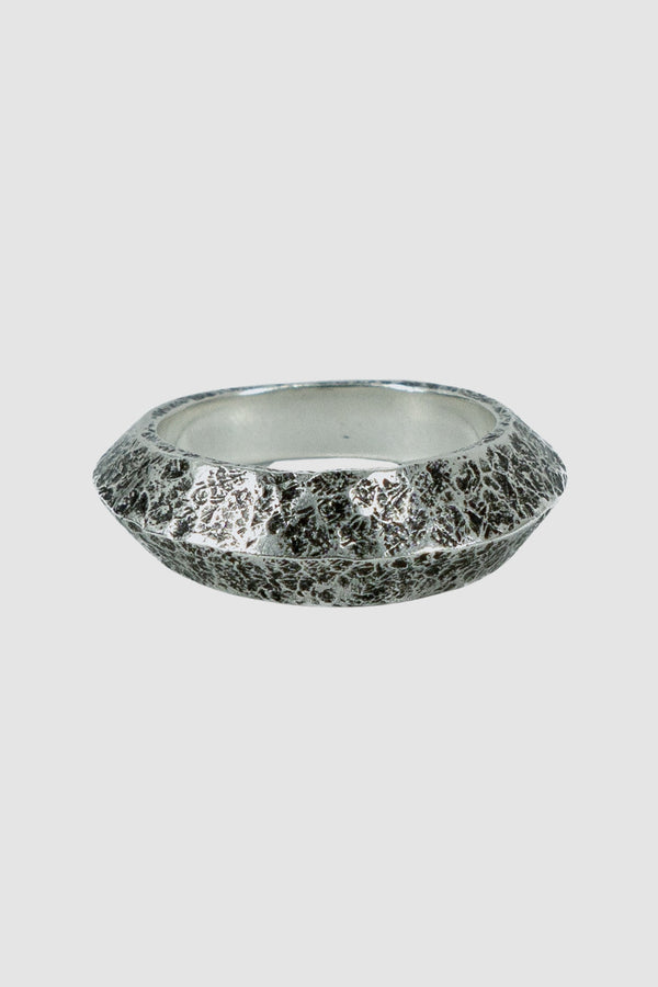 OLIVIER 925 silver wide tapered ridge ring from the Permanent collection with irregular hammered surface and tapered point, front view.