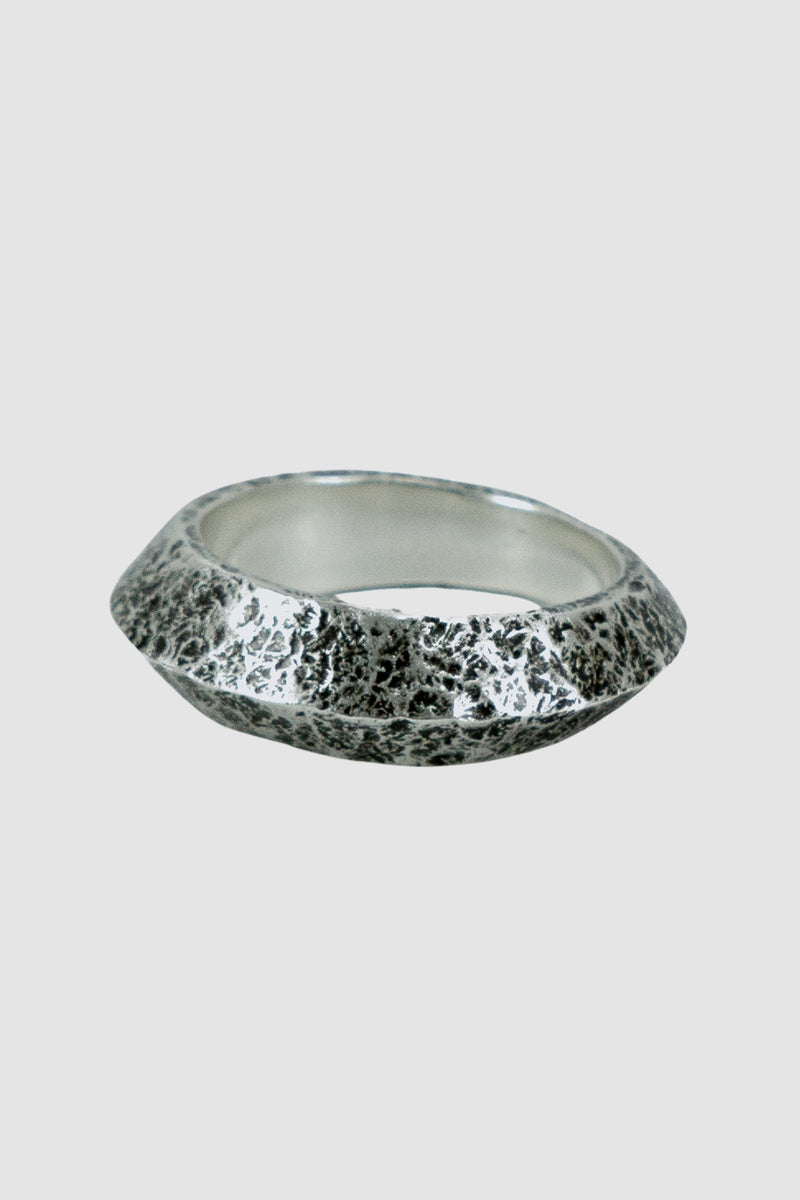 OLIVIER 925 silver wide tapered ridge ring from the Permanent collection with irregular hammered surface and tapered point, left view.