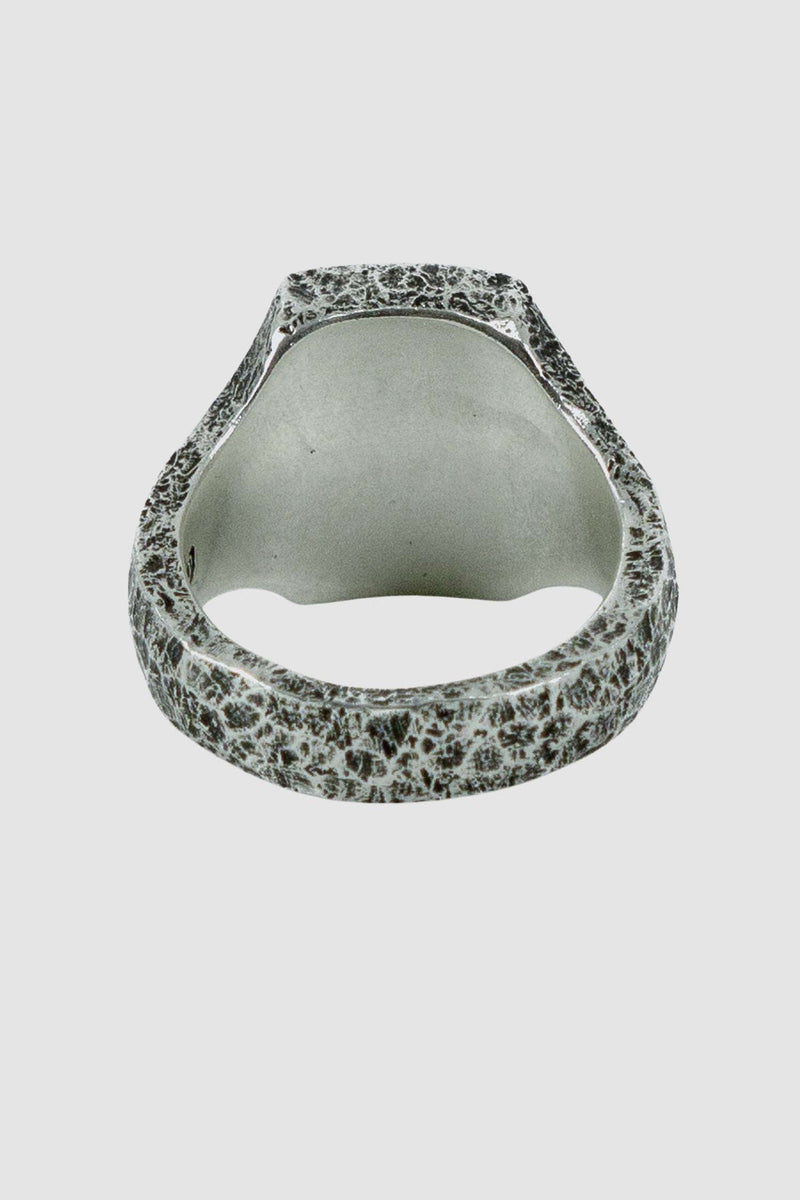OLIVIER 925 silver cushion cut signet ring from Permanent collection with irregular hammered surface and polished crest detail, back view.