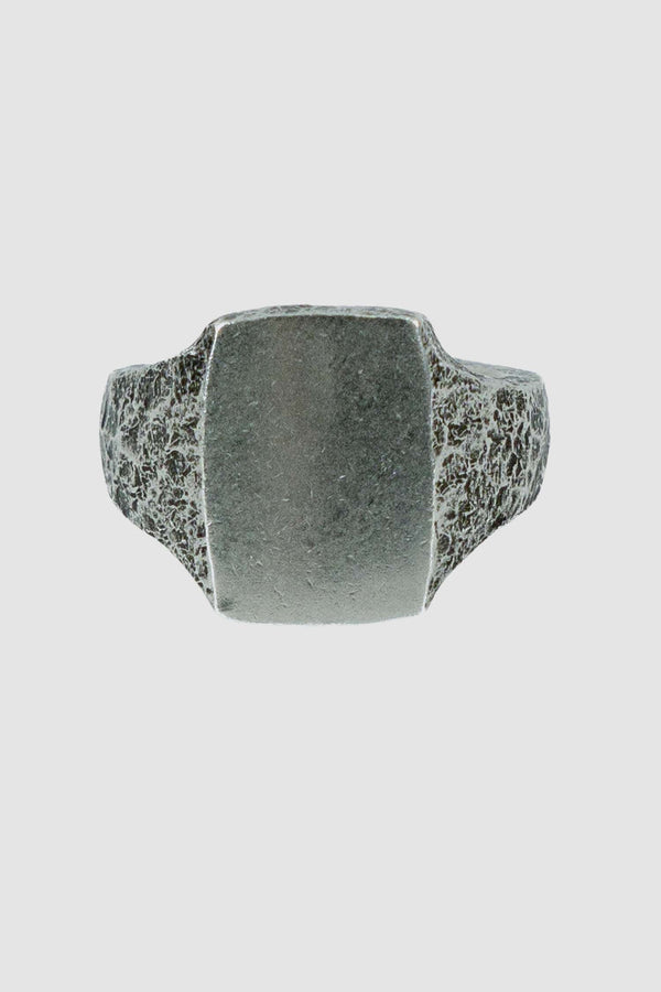 OLIVIER 925 silver cushion cut signet ring from Permanent collection with irregular hammered surface and polished crest detail, front view.