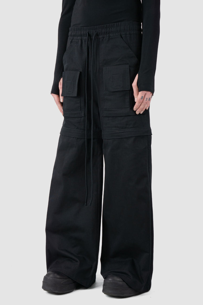 Ovnnie - front side view of the black Multifunctional Flared Pants NL12.