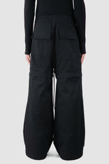 Ovnnie - back view of the black Multifunctional Flared Pants NL12.