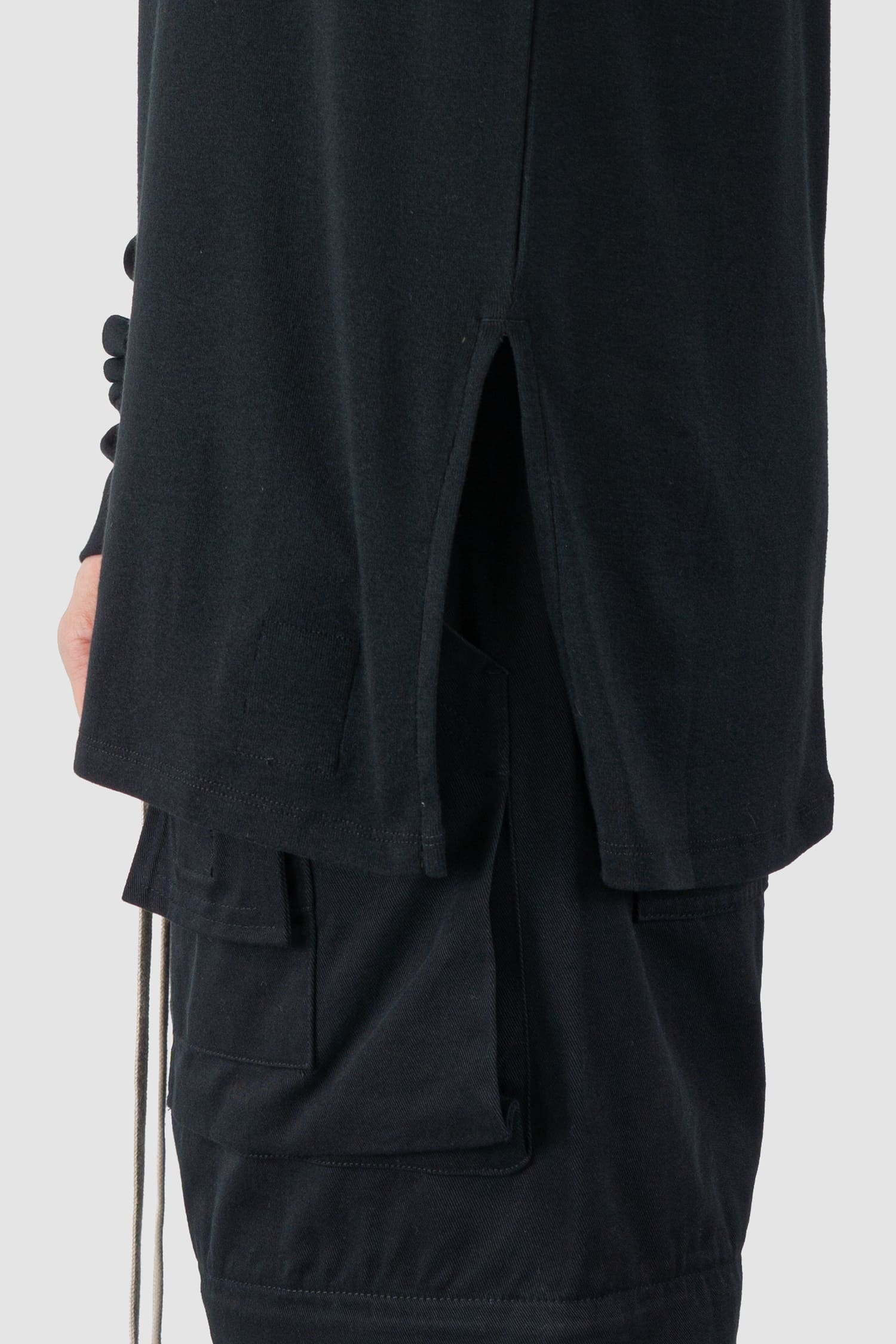 Ovnnie - slit view of the black Organic Cotton Long Sleeve T-Shirt.