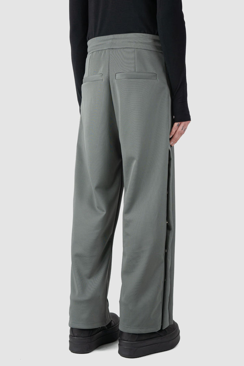 Ovnnie - back side view of the stone grey Push Button Track Pants.