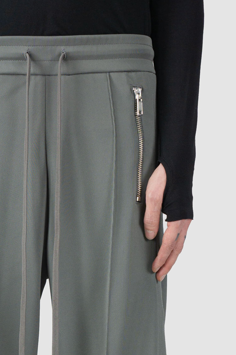 Ovnnie - waist view of the stone grey Push Button Track Pants.