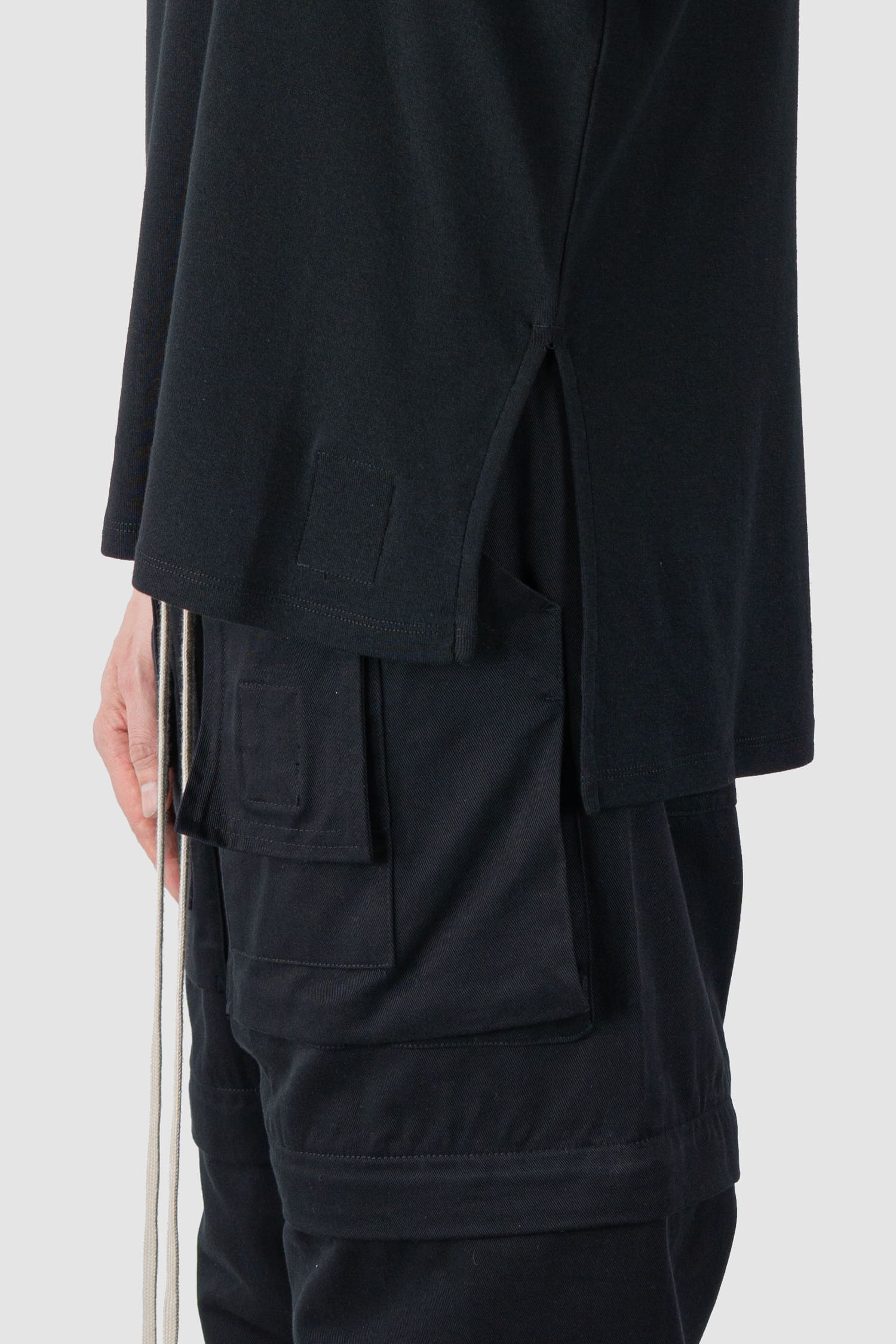 Ovnnie - slit detail view of the black Standard Cotton Basic T-Shirt.