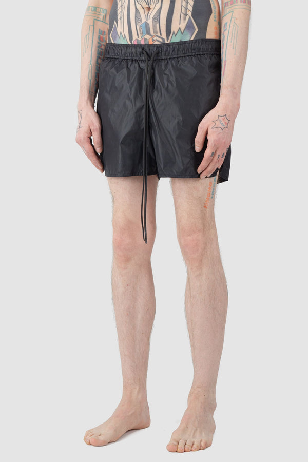 Ovnnie - front side view of the black Swim Trunks.