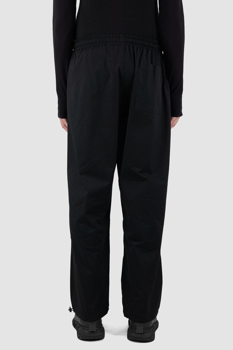 Back view of Black Parachute Cotton Pants for Men with adjustable hem, LA HAINE INSIDE US
