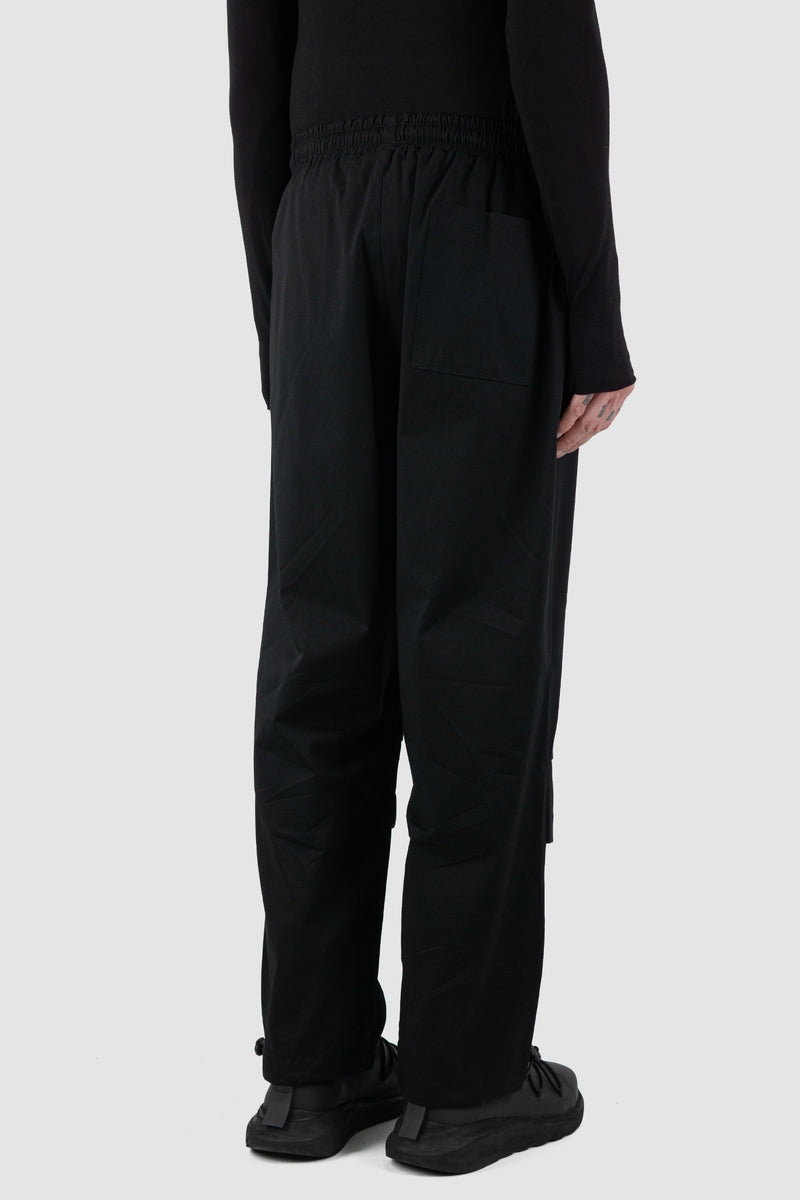 Back view of Black Parachute Cotton Pants for Men with adjustable hem, LA HAINE INSIDE US