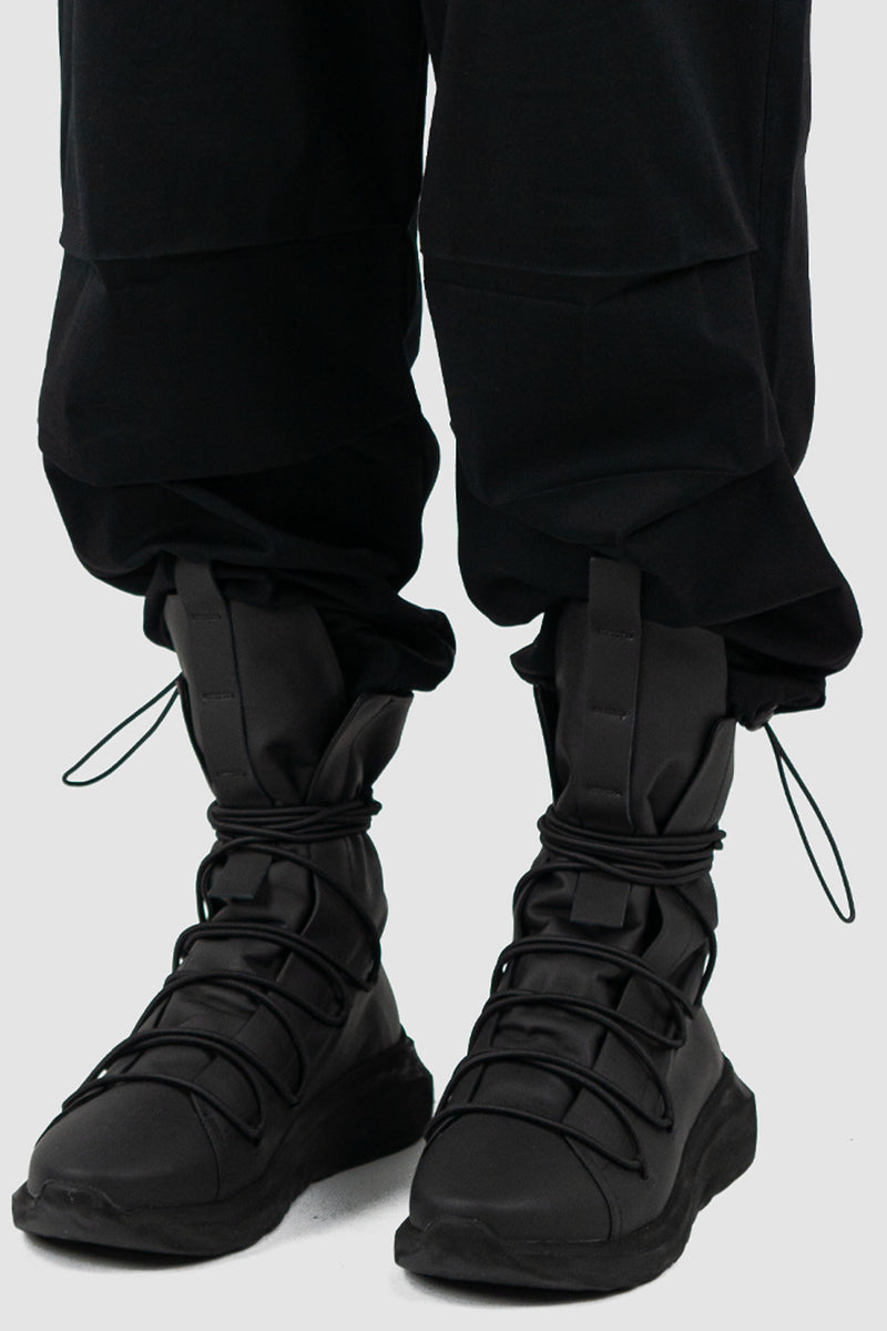 Detail view of Black Parachute Cotton Pants for Men with adjustable hem, LA HAINE INSIDE US