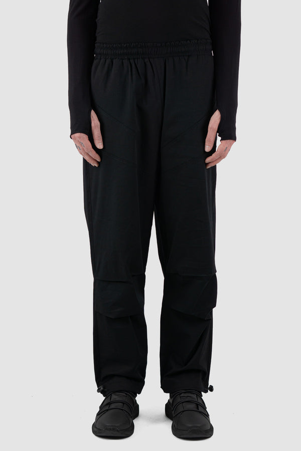 Front view of Black Parachute Cotton Pants for Men with adjustable hem, LA HAINE INSIDE US
