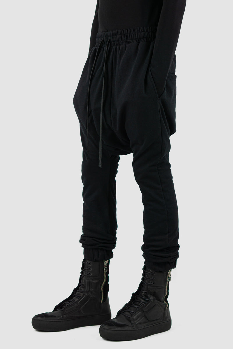 Styling view of Black Patty Sweatpants showing elastic waistband, XCONCEPT