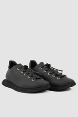 Puro Secret - front right view of matte black leather summer step man sneaker for men from the Permanent Collection with parachute laces and a square end sole.