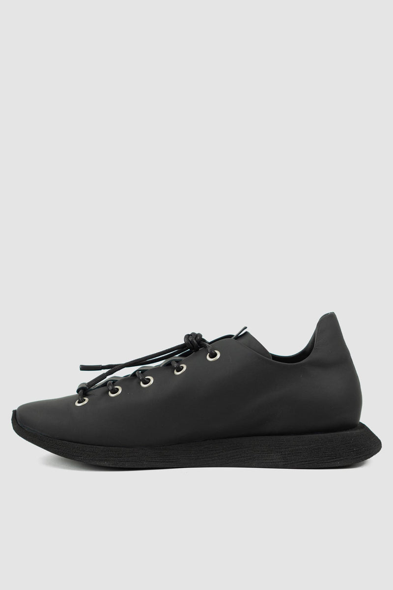 Puro Secret - left view of matte black leather summer step man sneaker for men from the Permanent Collection with parachute laces and a square end sole.