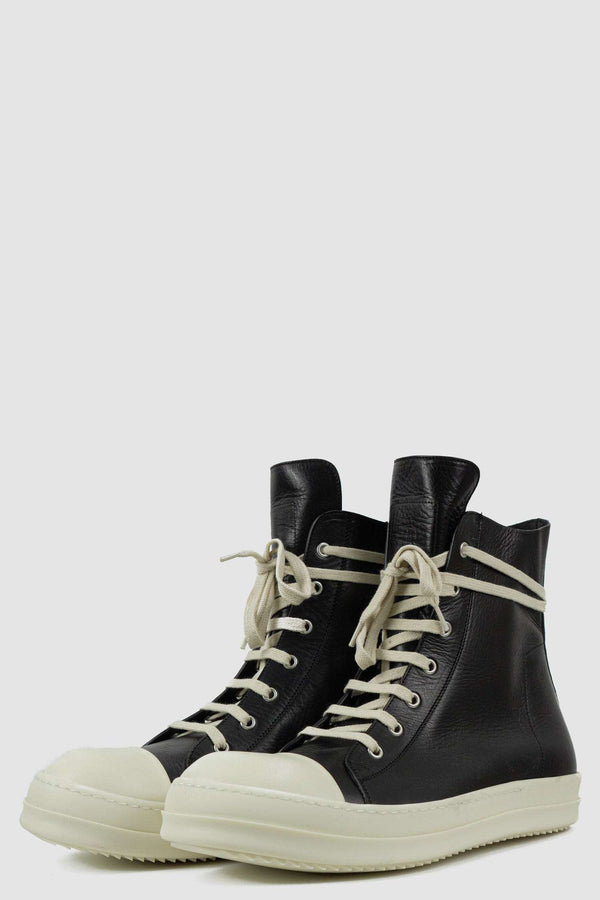 RICK OWENS black Ramones leather sneaker from FW21 featuring a milk white toe cap and an inside zipper front right.