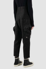 RICK OWENS black high-waisted cargo pants from the FW18 runway, in thick cotton twill with oversized cargo pockets back right view.