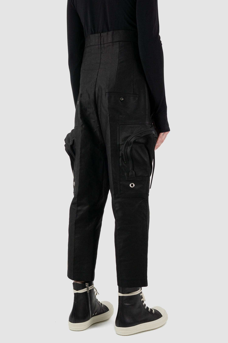 RICK OWENS black high-waisted cargo pants from the FW18 runway, in thick cotton twill with oversized cargo pockets back right view.