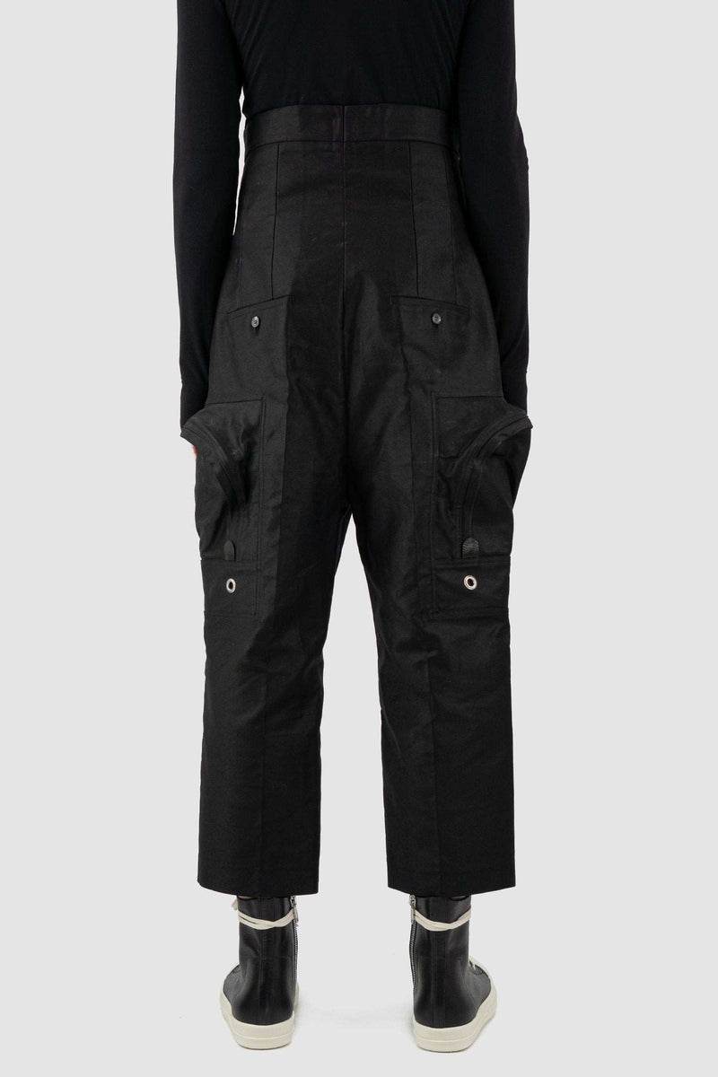 RICK OWENS black high-waisted cargo pants from the FW18 runway, in thick cotton twill with oversized cargo pockets back view.