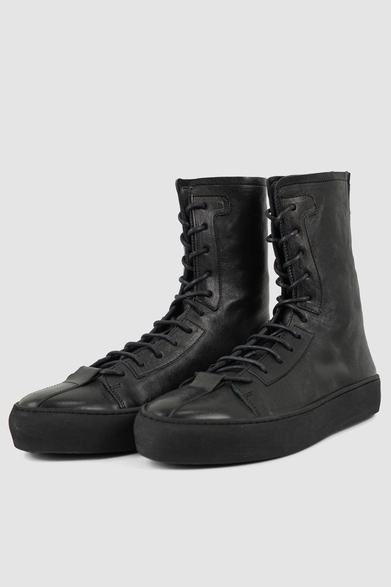 The Last Conspiracy - front left view of Black Leather High Top Sneaker for Men from SS24 Collection with Excella Back Zip Detail.