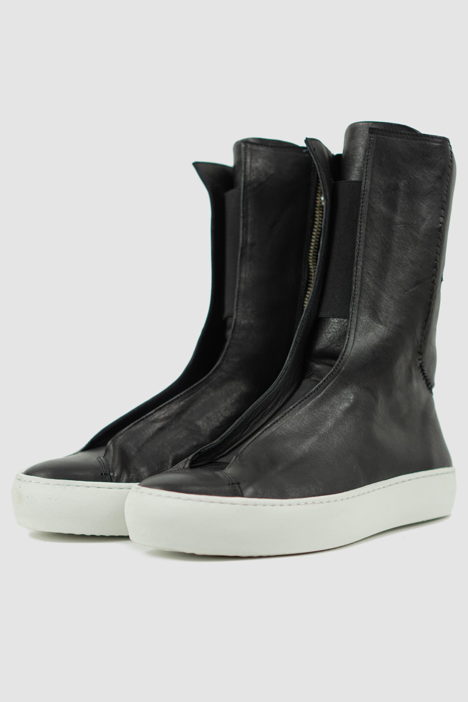 The Last Conspiracy - front left view of Black Leather High Top Sneaker for Men from the Permanent Collection with Contrast Puffed Sole.