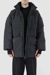 UY Studio - Front open view of black big puffer coat with big patch stitched pockets.