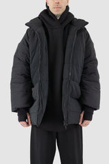 UY Studio - open hood view of black big puffer coat with big patch stitched pockets.