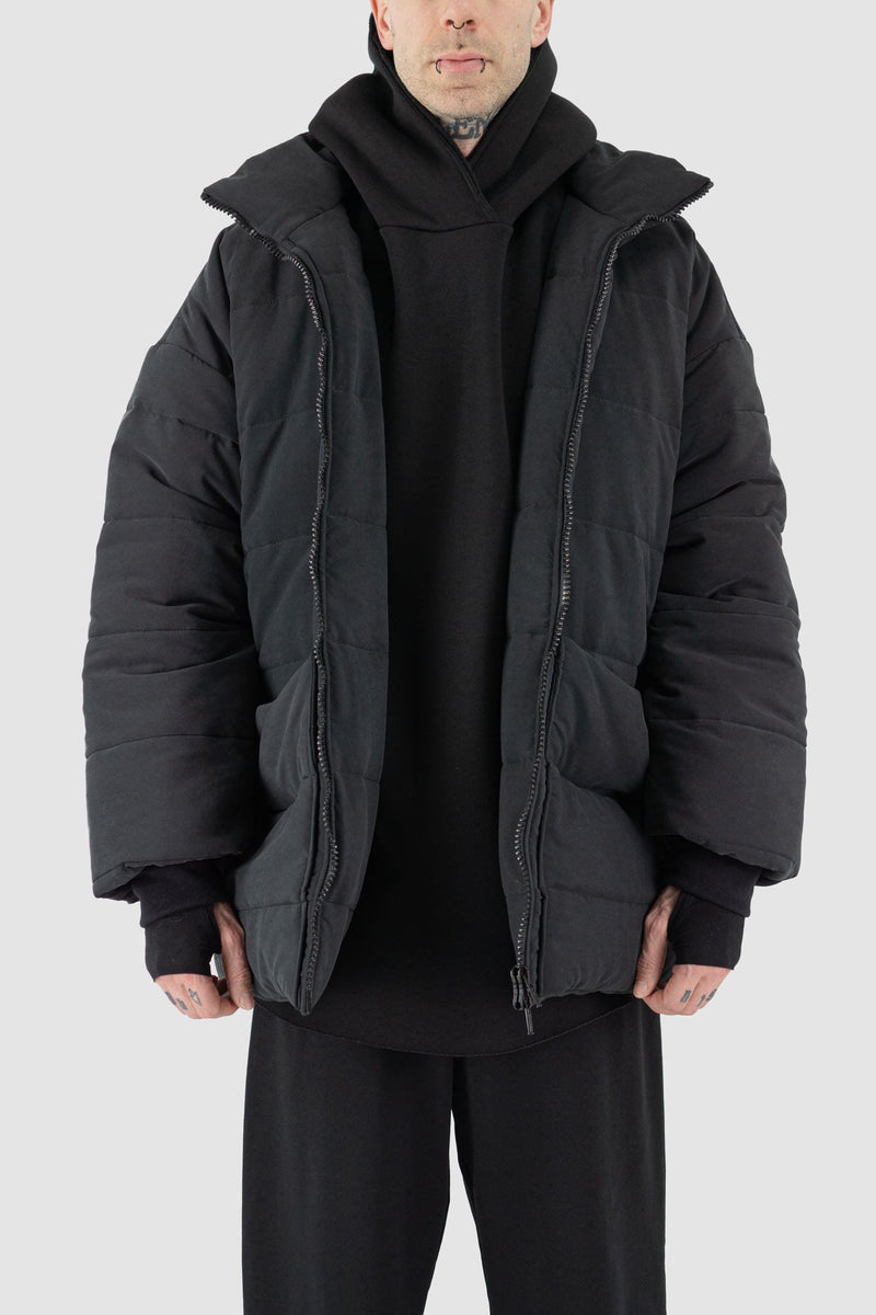 UY Studio - open hood view of black big puffer coat with big patch stitched pockets.