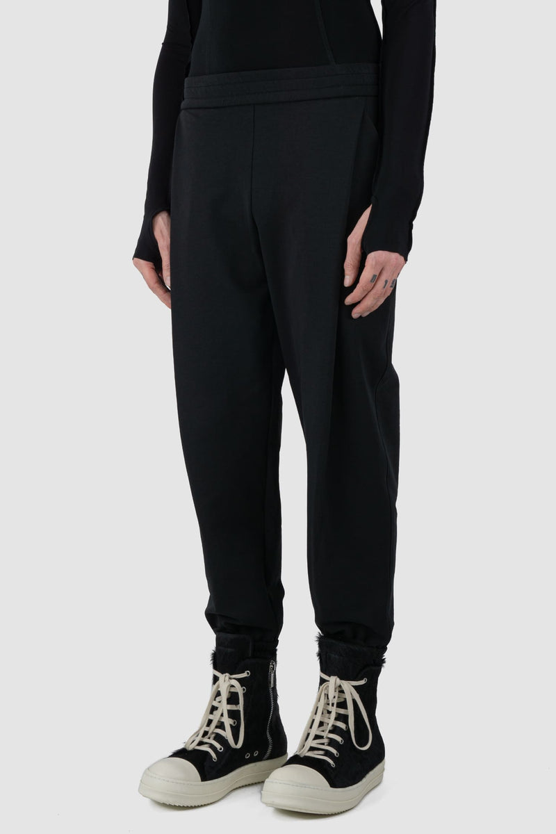 UY Studio - front side view of black casual jogging pants for men.