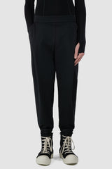 UY Studio - front relaxed view of black casual jogging pants for men from the FW24 collection feature a flexible elastic waistband and leg cuffs, offering both comfort and style.