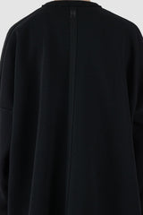 UY Studio - back detail view of big black cozy oversized cotton sweater for men from the FW24 collection offers a relaxed, baggy fit with a round neckline and stylish pleated sleeves.