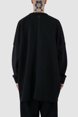 UY Studio - back view of big black cozy oversized cotton sweater for men from the FW24 collection offers a relaxed, baggy fit with a round neckline and stylish pleated sleeves.