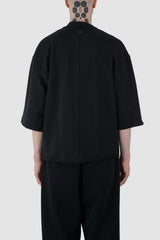 UY Studio - back view of Black Cropped Heavy Cotton T-Shirt for men from the FW24 collection features an oversized fit with extended shoulders and a close-fitting collar.