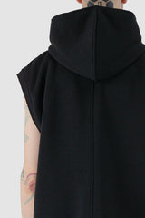 UY Studio - back hood view of black jumbo hooded tank top for men from the FW24 collection with a large, cozy hood, open end seams and made of thick, warm cotton.