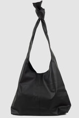 UY Studio - back view of black Knotti XL vegan leather bag with tie-around straps design, press button closure, Permanent Collection.