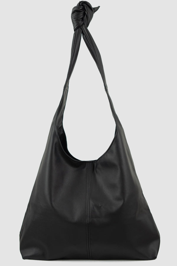 UY Studio - Front view of black Knotti XL vegan leather bag with tie-around straps design, press button closure, Permanent Collection.