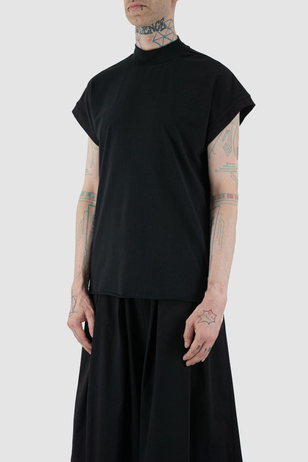 UY Studio - front side view of black raglan top with a high neckline.