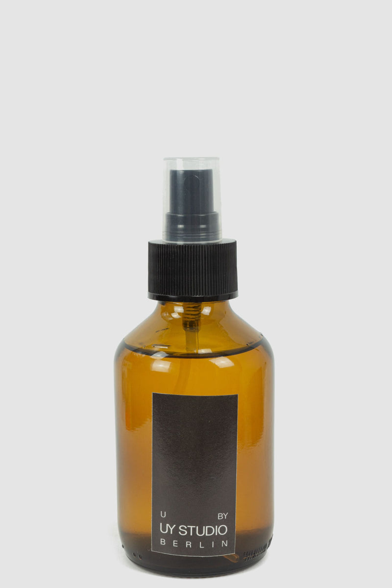 UY Studio - Front view of Signature Room Spray U in 150ml amber glass flacon with plastic trigger, Permanent Collection.