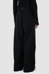 UY Studio - back side view of Black Thick Cotton Wide-Leg Jogger Pants for men from the FW24 collection are crafted from warm, thick cotton, featuring a chunky elastic waistband and two double seams at the front.