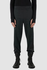 UY Studio - Front view of black Less pants with carrot cut, elastic waist, made from cotton twill, Permanent Collection.