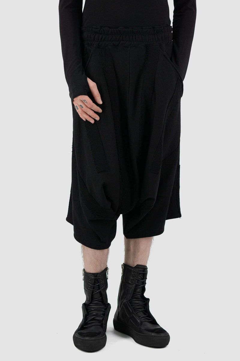 Front view of Black Cropped Cotton Pants for Men with applied patch details, LA HAINE INSIDE US