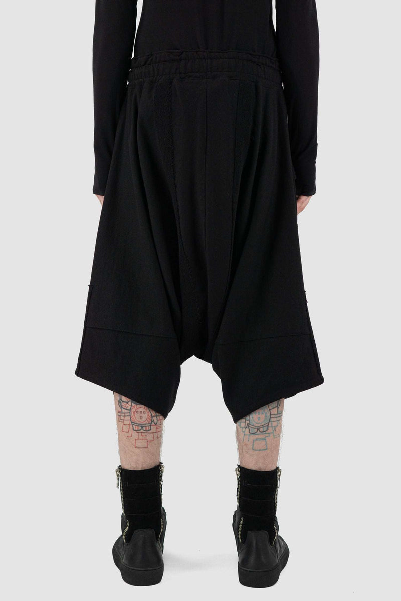 Back view of Black Cropped Cotton Pants for Men with applied patch details, LA HAINE INSIDE US
