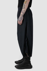 XConcept - side view of Black Cropped Loose Fit Linen Trousers