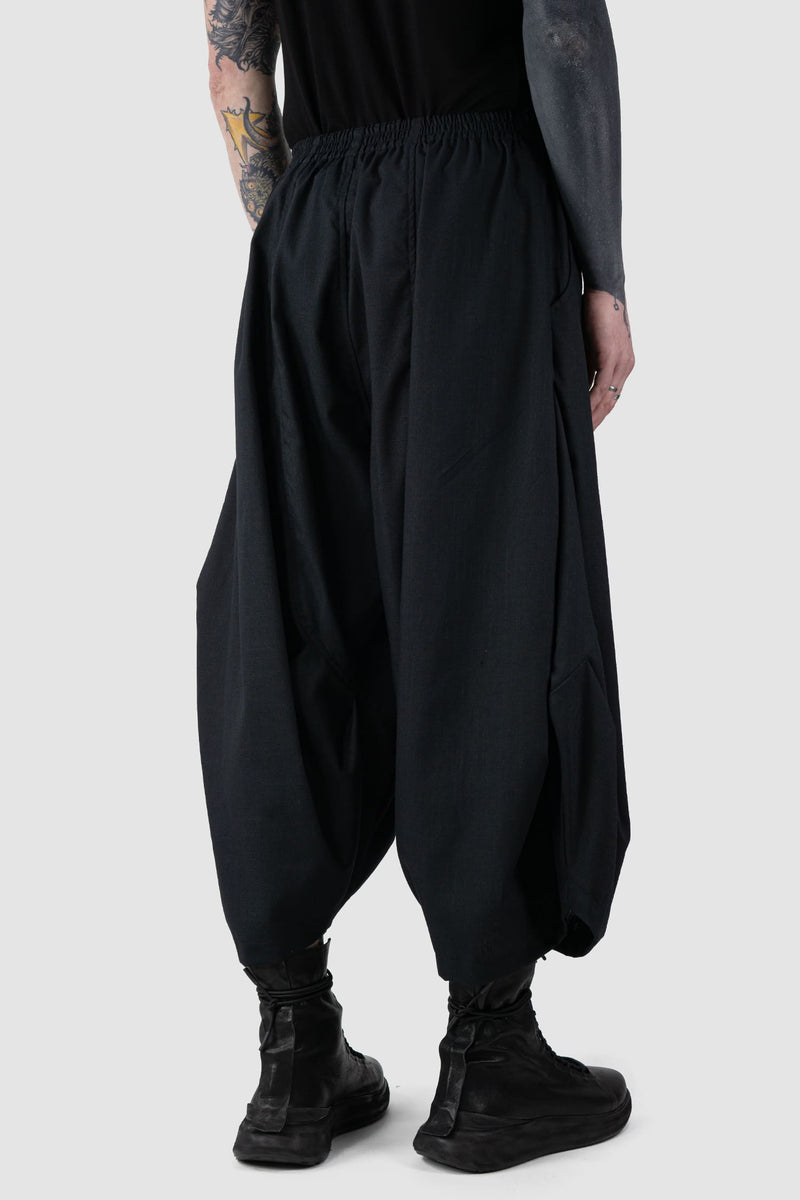 XConcept - back side view of Black Cropped Loose Fit Linen Trousers